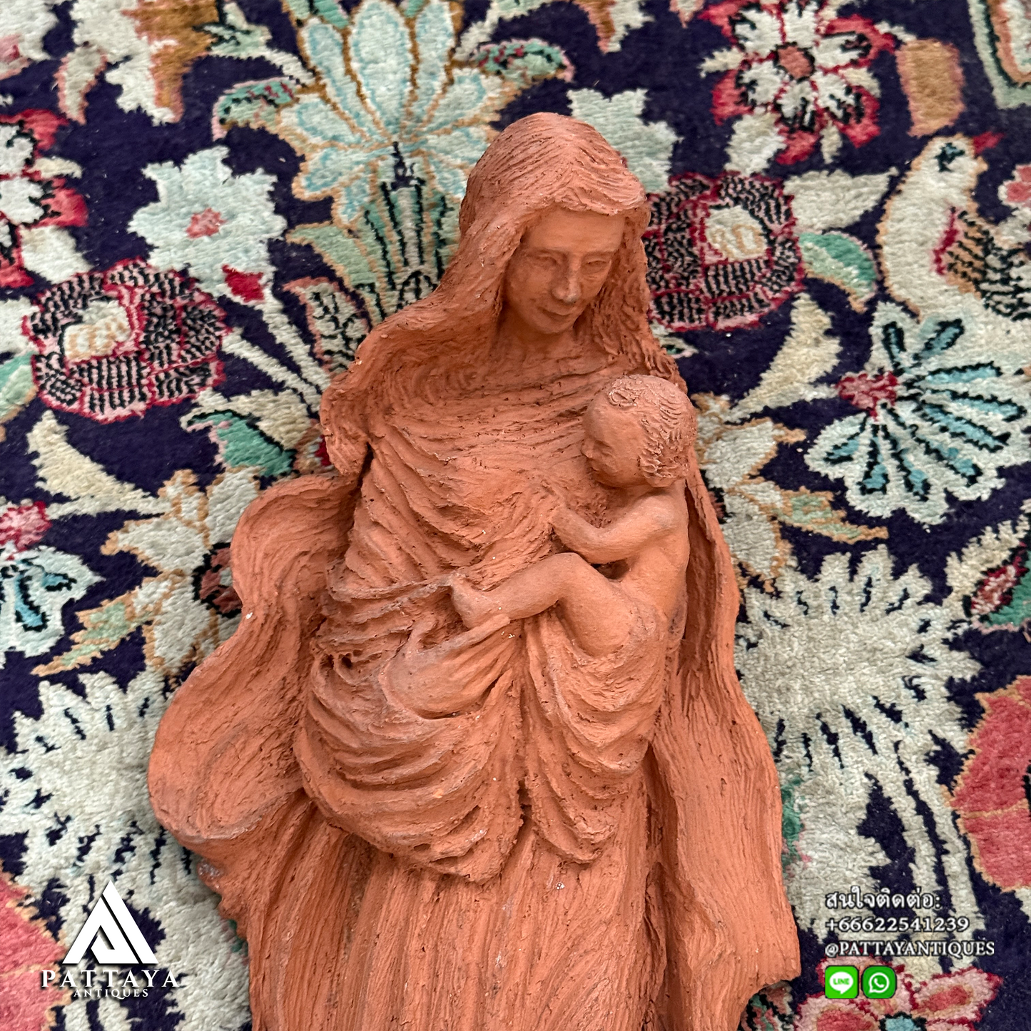 Terracotta Mary holding infant Jesus