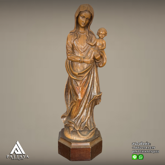 Vintage Mary statue on wooden base